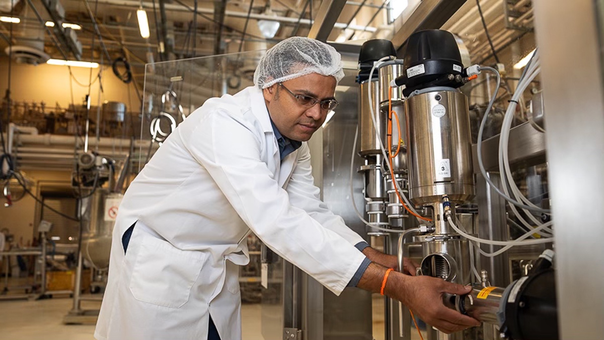 Professor adjusts equipment in Pilot Plant.
