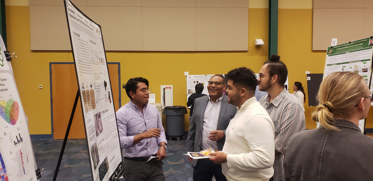 People viewing research poster